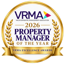 A VRMA 2026 Property Manager of the Year award badge with laurel wreaths and a gold ribbon.