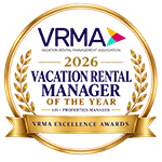 A circular badge with gold frame, purple-blue text &ldquo;VRMA 2021VACATION RENTAL MANAGER&rdquo; and a red &ldquo;Top it at 140 characters, always ending the sentence.&rdquo;