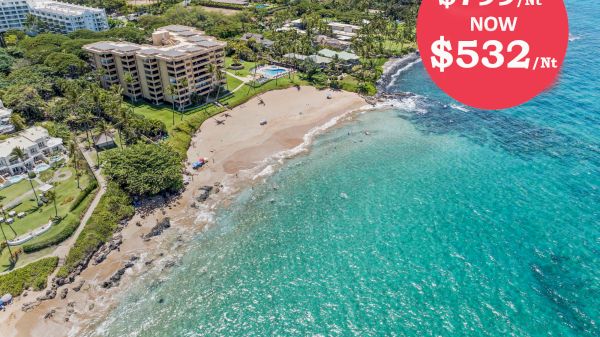 The image shows a beach with clear turquoise water and a nearby building, featuring a price drop from $799 to $532 per month.