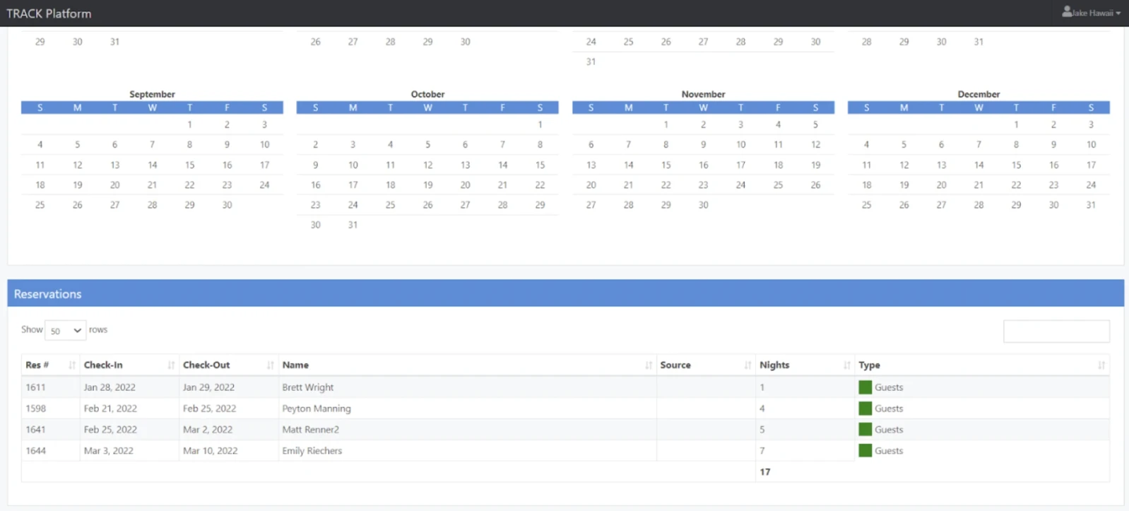 A calendar view with monthly grids and a reservations table below, listing guest names, check-in/out dates, source, nights, and type.