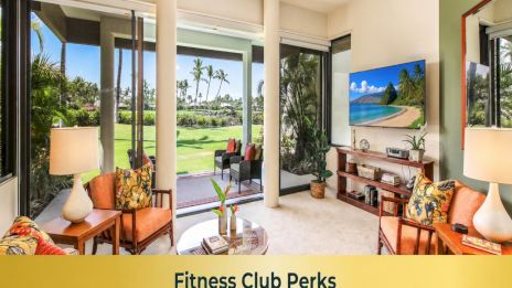 A bright, airy living room with sliding glass doors opening to a sunny outdoor area, tropical plants, and a beachy fitness club vibe.